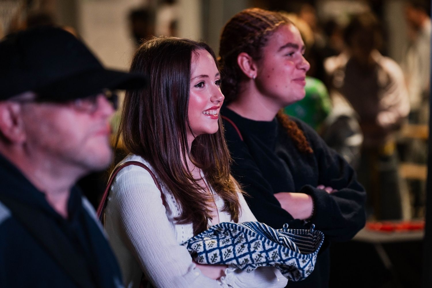 Students smiling at event